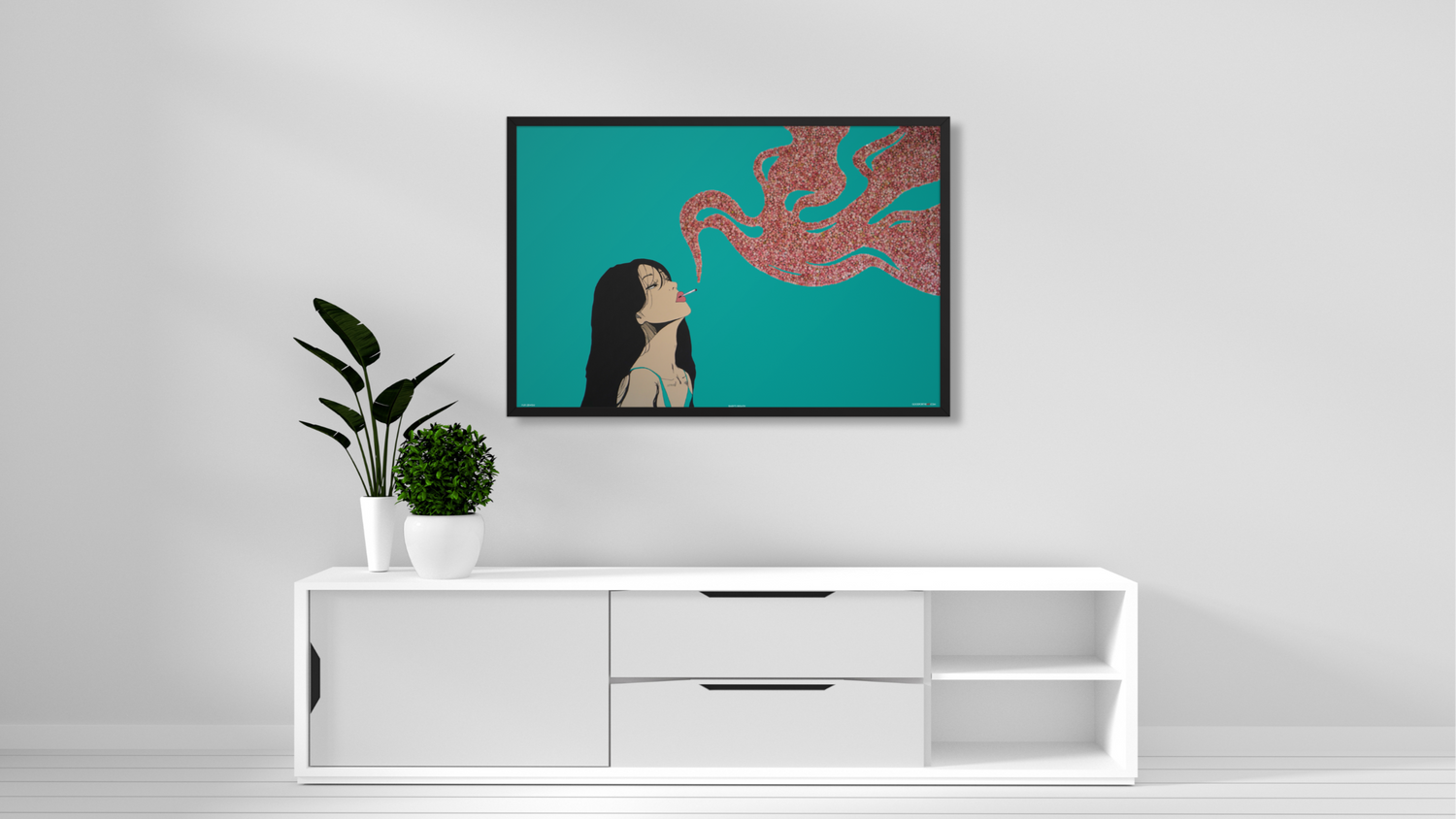 Framed artwork on a wall above a white console table with plants.